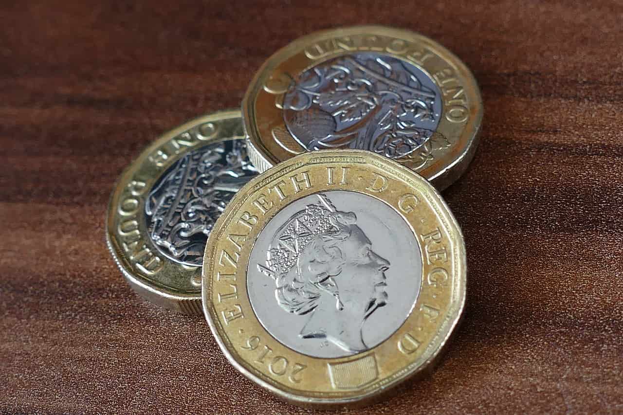 pound coins on a table